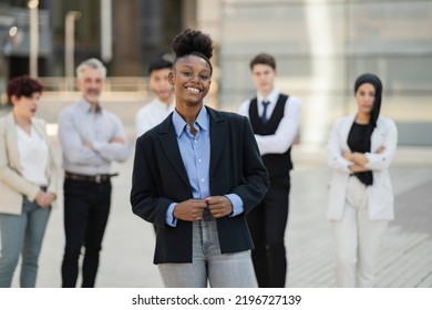 Group Of Business People Meeting Outside, African Woman In Front