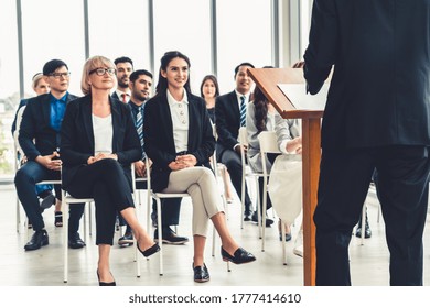 Group Of Business People Meeting In A Seminar Conference . Audience Listening To Instructor In Employee Education Training Session . Office Worker Community Summit Forum With Expert Speaker .