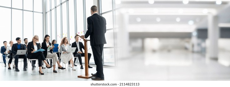 Group Of Business People Meeting In A Seminar Conference Widen View . Audience Listening To Instructor In Employee Education Training Session . Office Worker Community Summit Forum With Speaker .