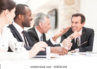 Group Of Business People Meeting At Table