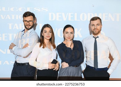 group of business people on the background of motivational words. - Powered by Shutterstock