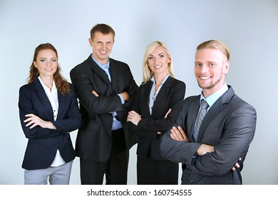 Group of business people on gray background - Shutterstock ID 160754555