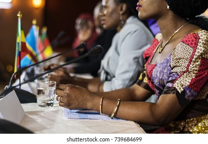 A Group Of Business People Participating In A Panel Discussion 