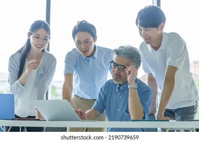 Group Of Business People Paying Attention To The Computer Screen