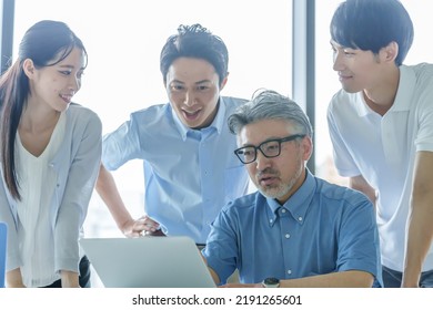 Group Of Business People Paying Attention To The Computer Screen