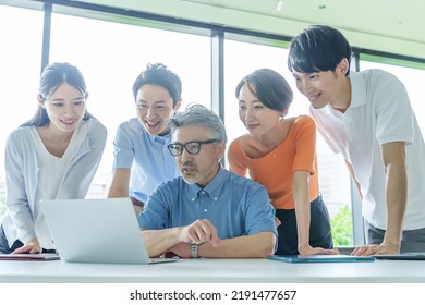 Group Of Business People Paying Attention To The Computer Screen