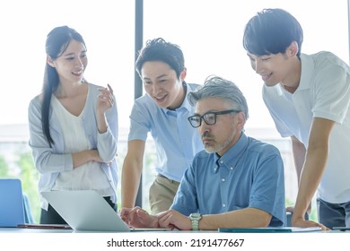 Group Of Business People Paying Attention To The Computer Screen