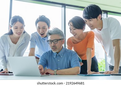 Group Of Business People Paying Attention To The Computer Screen