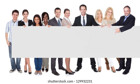 Group Of Business People Presenting Empty Banner. Isolated On White