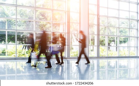 Group Of Business People Rushing In The Lobby. Motion Blur