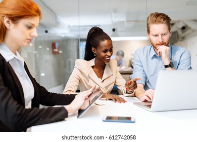 Group of business people sitting at desk and having a meeting about future strategy