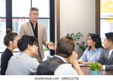 Group of business people sitting listen and present reviews in meeting room, leadership present, business teamwork partner concept. - Shutterstock ID 1685121736