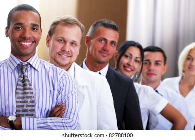 Group Of Business People Smiling In An Office Lined Up