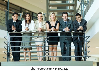 group of business people standing by stairway