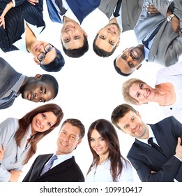 Group Of Business People Standing In Huddle, Smiling, Low Angle View