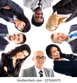 Group Of Business People Standing In Huddle, Smiling, Low Angle View