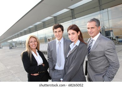 Group Of Business People Standing Outside Building