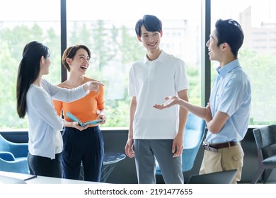 group of business people talking in the office - Shutterstock ID 2191477655