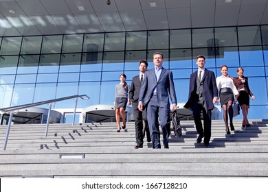 Group Of Business People And Their Leader Walking Down Stairs Outside Office Building Successul Deal Negotiation Concept