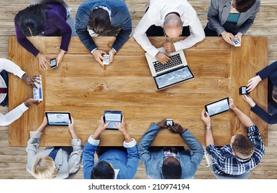 Group of Business People Using Digital Devices - Shutterstock ID 210974194