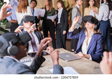 Group Of Business People Using Virtual Reality At Company Summit Meetings
