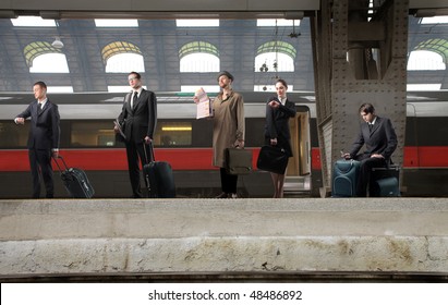 Group Of Business People Waiting For A Train On A Platform