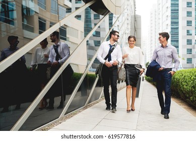 Group Of Business People Walking Talking.