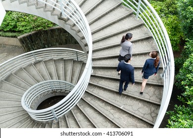 Group Of Business People Walking Upstairs