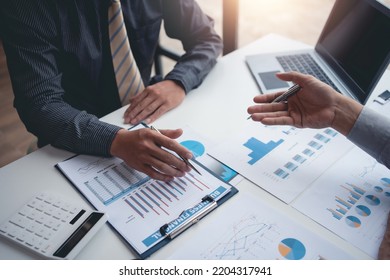 Group of business people who come to the meeting to assess the investment situation and analyze the company's revenue and business marketing strategies. - Shutterstock ID 2204317941