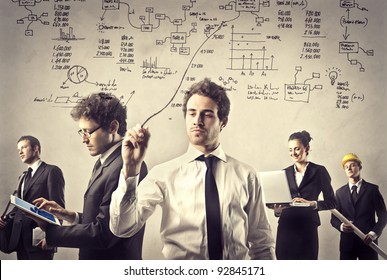 Group of business people at work - Shutterstock ID 92845171