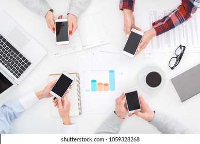 Group Of Business People Work Together Top View Holding Smartphones