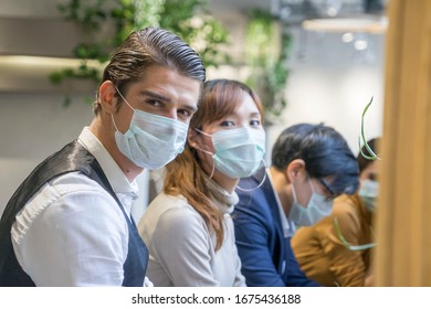 Group Of Business People Workers Talking Together With Laptop And Wear Protective Masks Prevent PM 2.5 And Corona Virus Or Covid 19 At Co Working Space Modern Office .Health And Teamwork Concept.