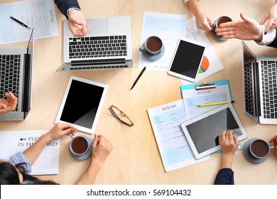 Group Of Business People Working At Desk, Top View