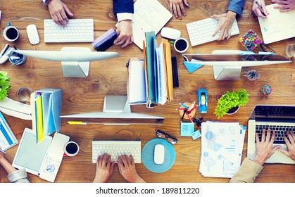 Group of Business People Working on an Office Desk