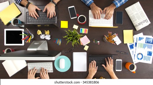 Group of Business People Working on an Office Desk