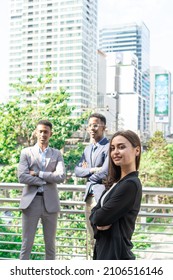 Group Of Business People.Business People Meeting Talking And Sharing Their Ideas In City. Business Team And Teamwork Concept. Business People Standing Outside In The City Discussing About New Project.