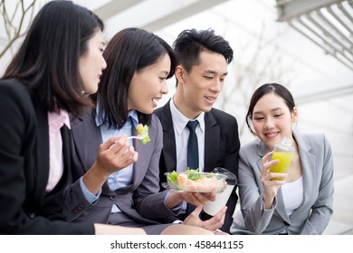 Group of business team having salad outside office - Powered by Shutterstock