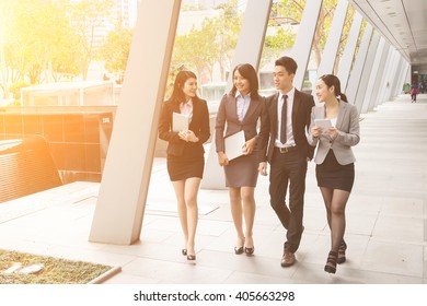 Group Of Business Team Walking At Street