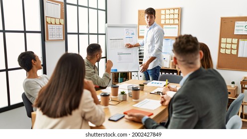Group of business workers listening boss conference during meeting at the office. - Shutterstock ID 2002427849