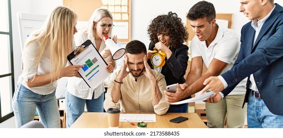 Group of business workers screaming to stressed partner at the office. - Powered by Shutterstock