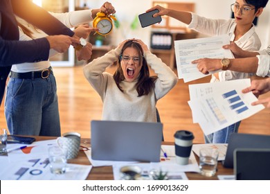 Group of business workers working together. Partners stressing one of them at the office - Powered by Shutterstock