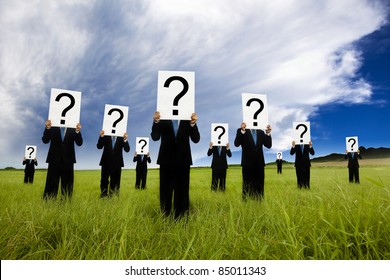 group of businessman in black suit and holding question mark symbol - Powered by Shutterstock