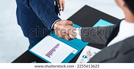 Group of businessman shaking hands in the office.