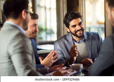 Group Of Businessmen Have A Talk