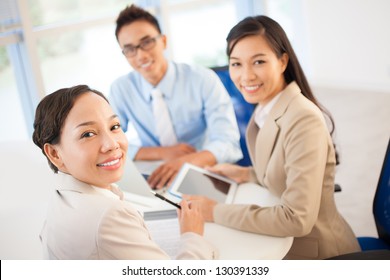 Group Of Businessmen At Meeting Indoors