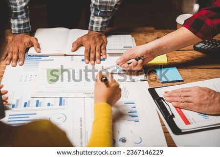 A group of businessmen met to expedite work to complete the project as scheduled. teamwork Working late hours, working night shifts [[stock_photo]] © 