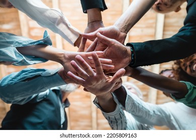 Group Of Businesspeople Joining Hands Together Standing In Circle, Closeup View From Bottom - Creative Business Teamwork Building Concept - Soft Skills Project