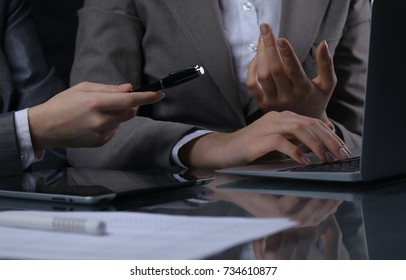 Group of businesspeople or lawyers at meeting. Low key lighting - Shutterstock ID 734610877