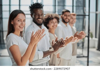 Group of businesspeople sitting in a line and applauding. - Shutterstock ID 2289072907