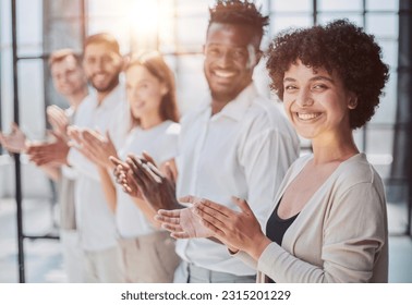 Group of businesspeople sitting in a line and applauding. - Shutterstock ID 2315201229